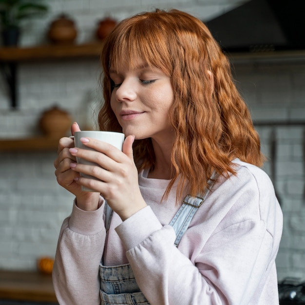 Medium shot woman with coffee cup