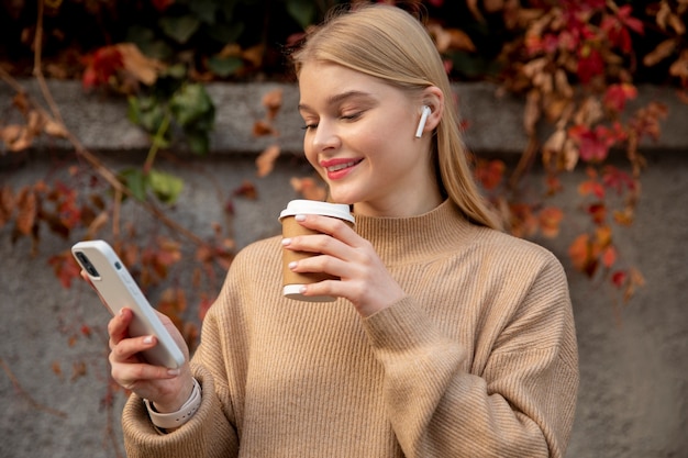 Medium shot woman with coffee cup