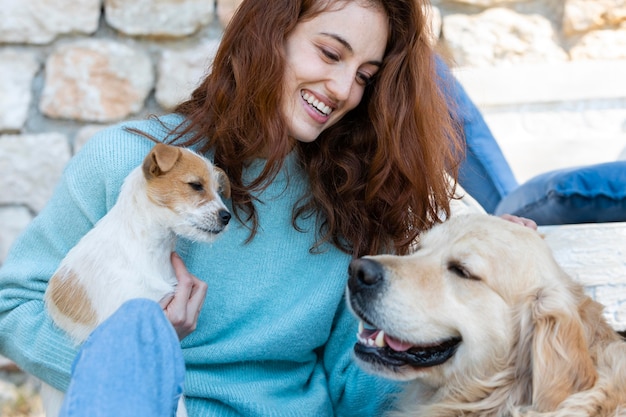 Free Photo medium shot woman with cute dogs