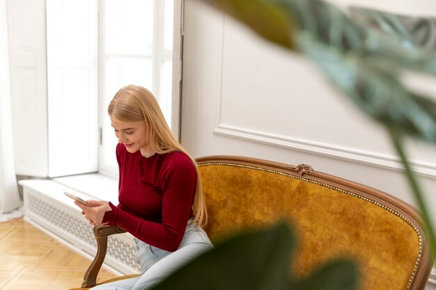 Medium shot woman with device