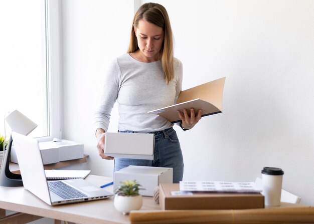 Medium shot woman with document