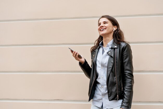 Medium shot woman with earphones