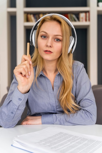 Medium shot woman with headphones