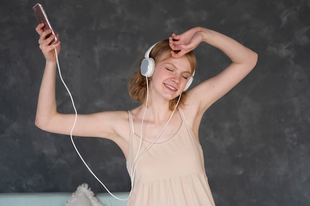 Medium shot woman with headphones