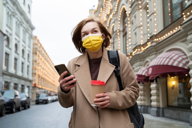 Medium shot woman with mask traveling