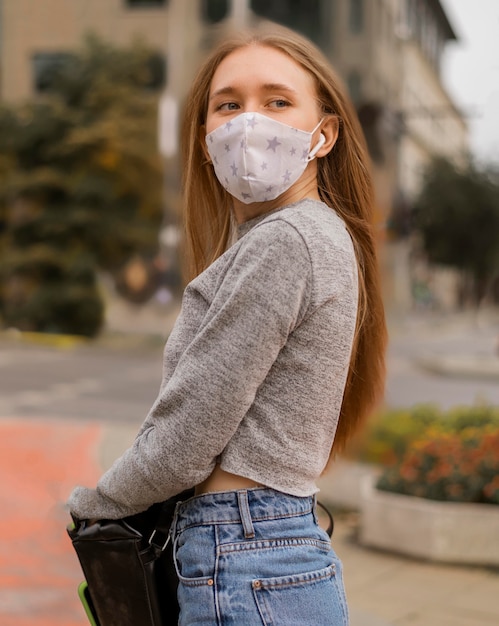 Medium shot woman with medical mask