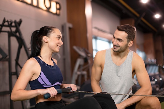 Free Photo medium shot woman with personal trainer