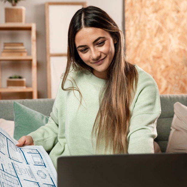 Medium shot woman with plans