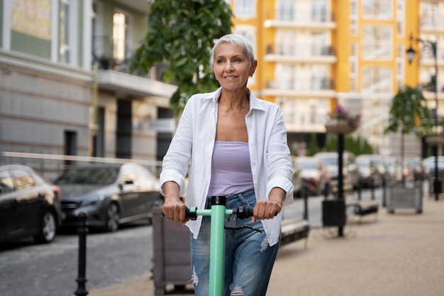 Medium shot woman with scooter