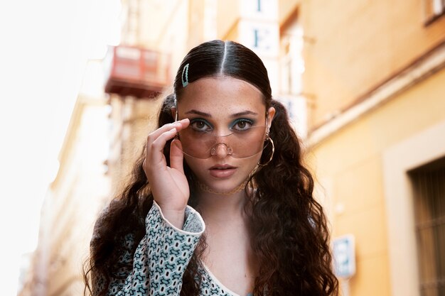 Medium shot woman with sunglasses