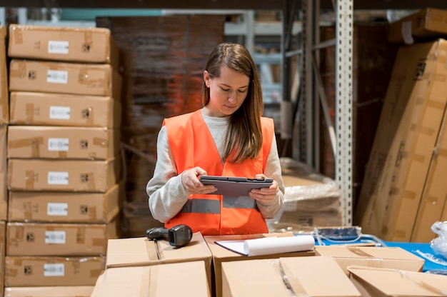 Medium shot woman with tablet