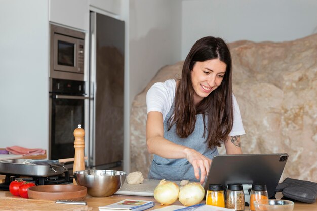 Medium shot woman with tablet