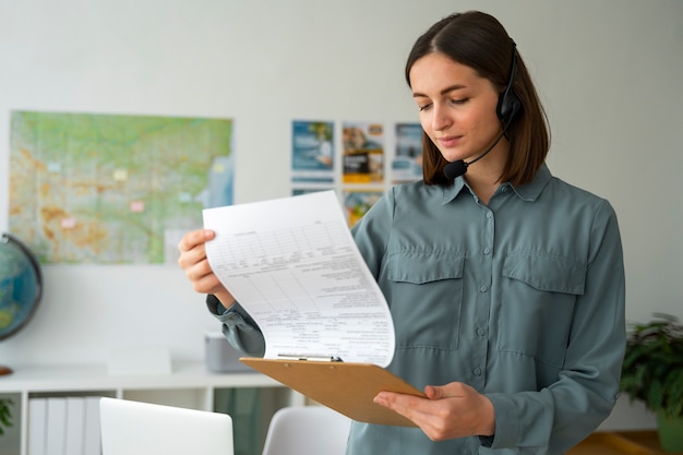 Medium shot woman working as a travel agent