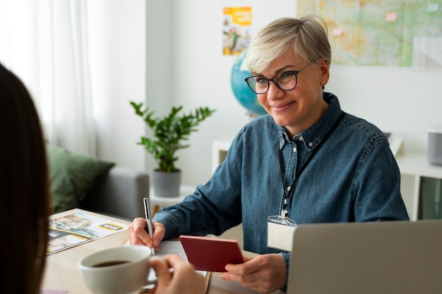 Medium shot woman working as a travel agent