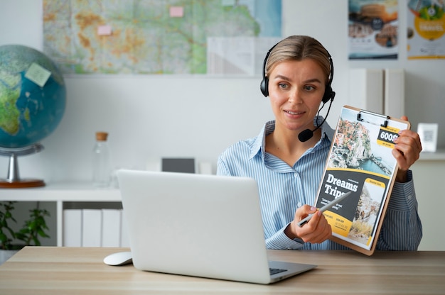 Medium shot woman working as a travel agent