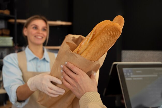 Medium shot woman working in bakery