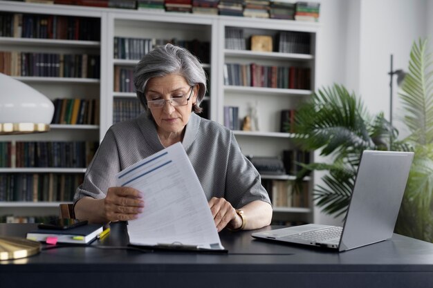 Medium shot woman working at desk