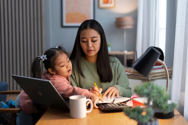 Medium shot woman working from home