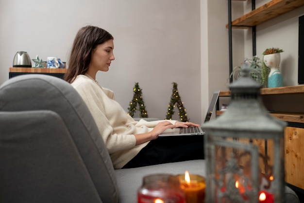 Medium shot woman working at home