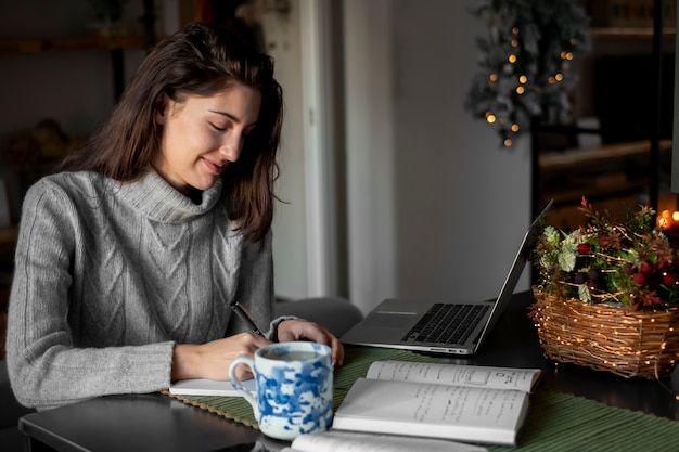 Free Photo medium shot woman working at home