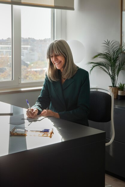 Medium shot woman working in office