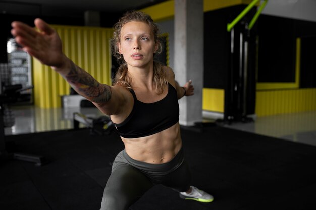 Medium shot woman working out