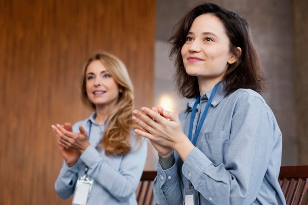 Free photo medium shot women clapping