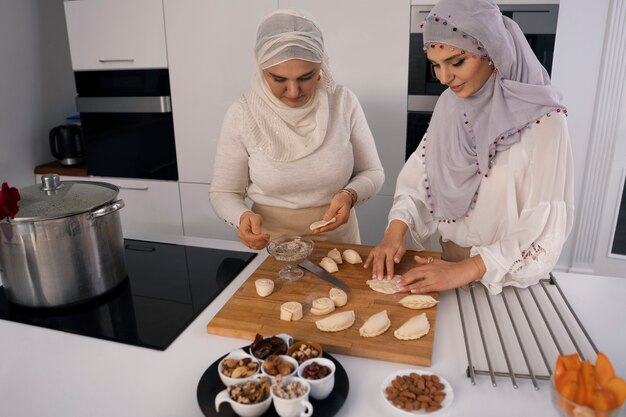 Medium shot women cooking for ramadan