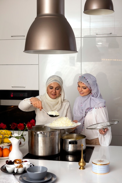 Medium shot women cooking for ramadan