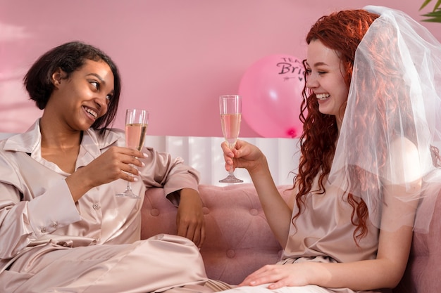 Medium shot women holding drinks