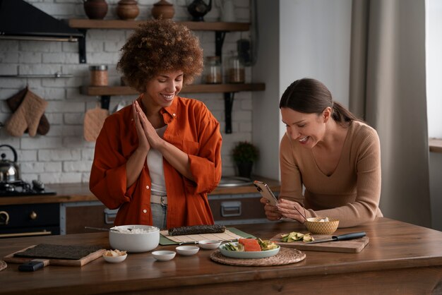 Medium shot women learning to make sushi