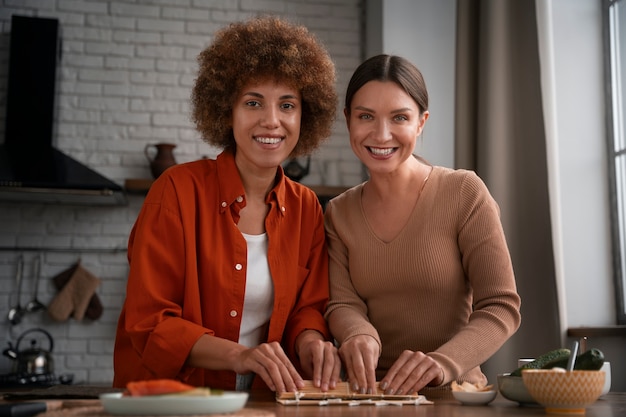 Medium shot women learning to make sushi