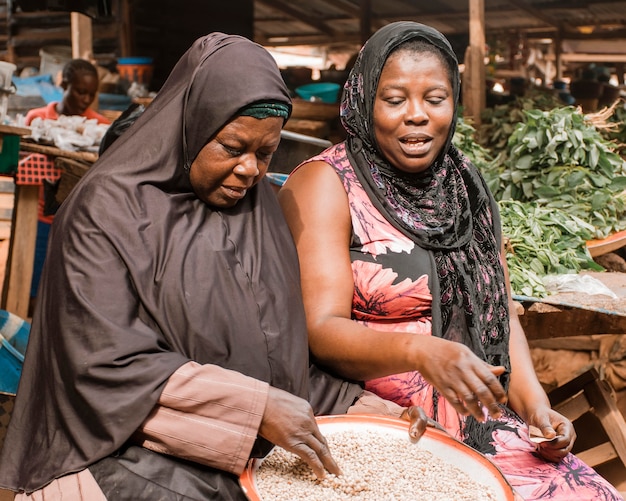 Medium shot women at market