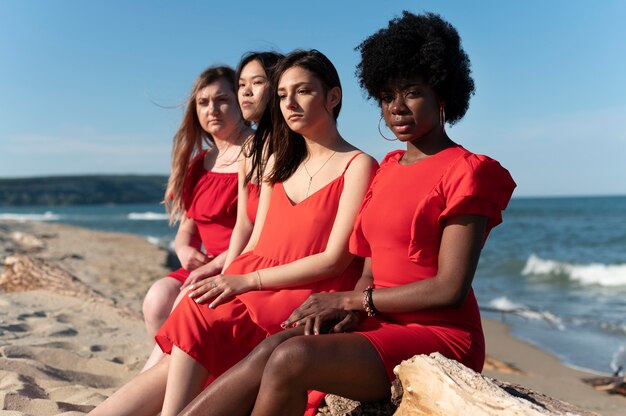 Medium shot women sitting outdoors