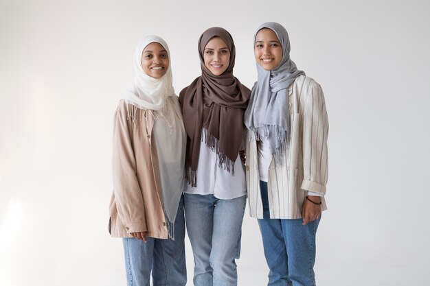 Medium shot women wearing hijabs