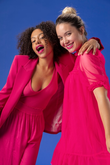 Medium shot women with pink outfits