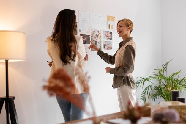 Medium shot women working as wedding planners