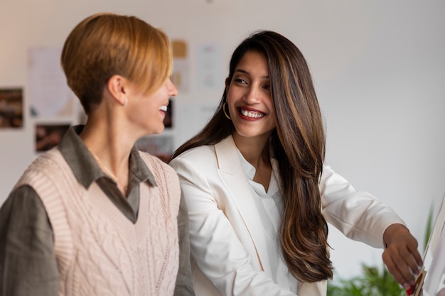 Medium shot women working as wedding planners