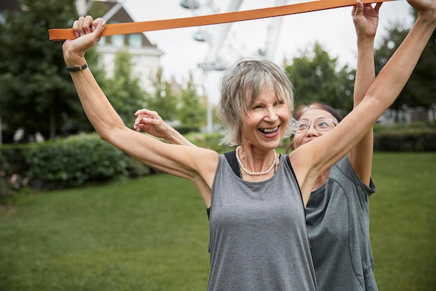 Medium shot women working out together