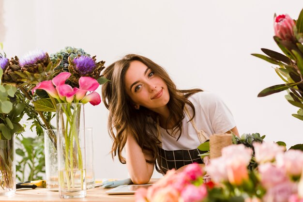 Medium shot young florist at flower shop