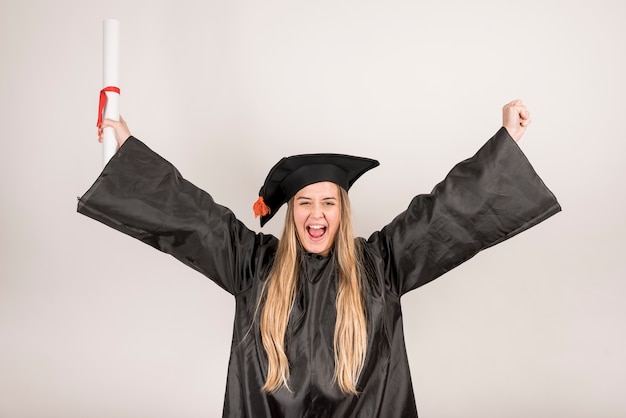 Medium shot young graduate being cheerful