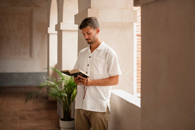 Medium shot young man praying