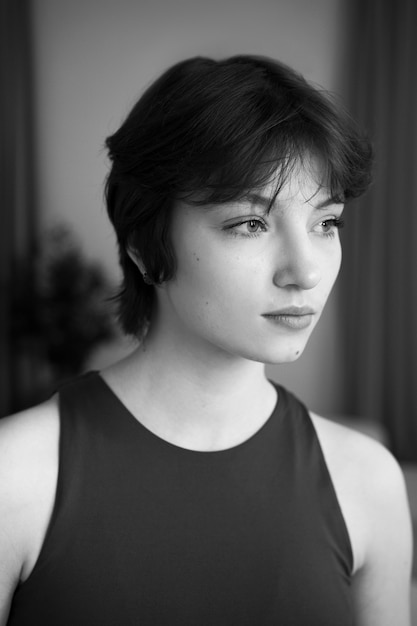 Free photo medium shot young woman posing indoors