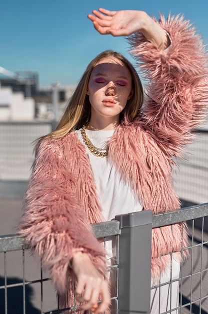 Medium shot young woman with chain necklace