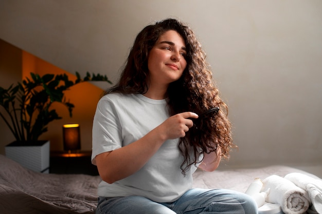 Free photo medium shot young woman with curly hair