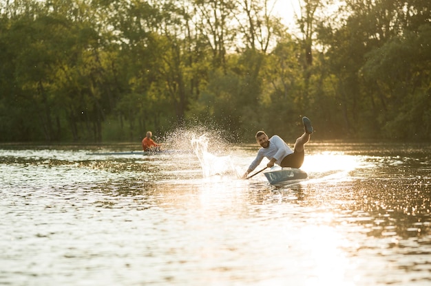 Men in canoe rowing concept