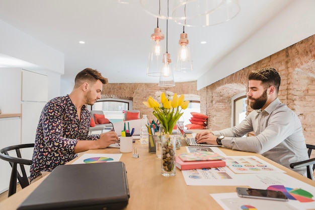 Free Photo men coworking in office