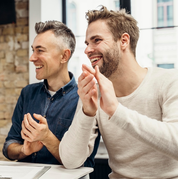 Free photo men discussing business while smiling