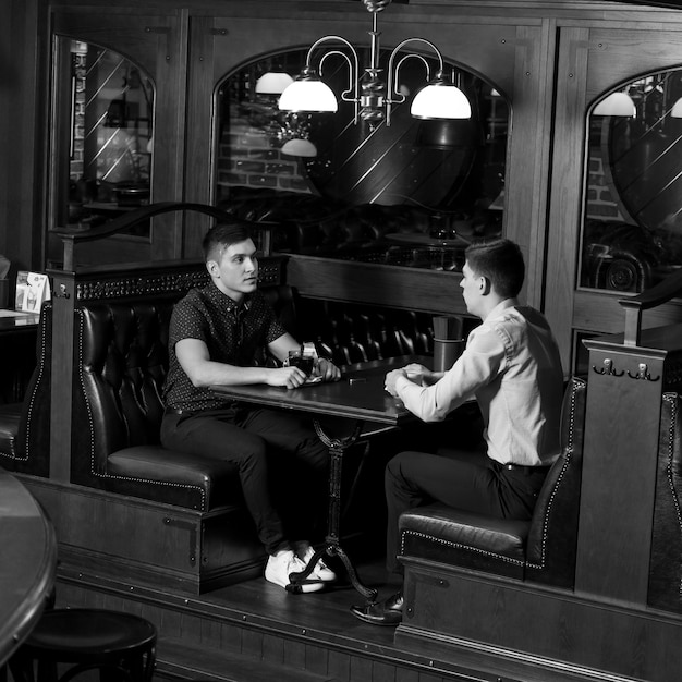 Free Photo men having conversation in cafe