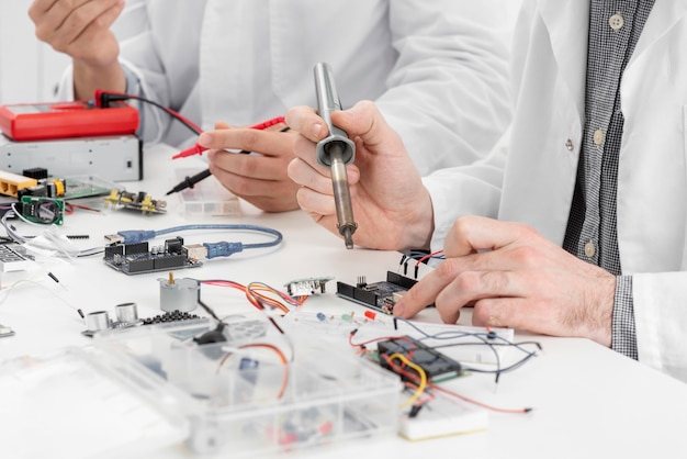 Men in lab doing experiments close up